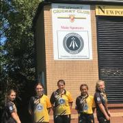 Players from Newport cricket club's under-13 girls' team show off the new shirt sponsor.