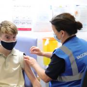 A 15-year-old receives his first coronavirus vaccine. Picture: Damien Storan/PA Wire