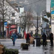 People in Chepstow town centre on December 26, 2021, the day Alert Level Two restrictions were imposed in Wales. Picture: Huw Evans Picture Agency
