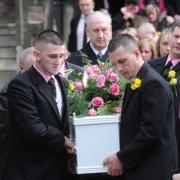 FINAL JOURNEY: Nikitta Grender's coffin is carried from St John's church in Maindee by her father father Paul Brunnock and boyfriend Ryan Mayes