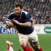 GRIM NIGHT IN PARIS: James Hook can only look on as France  lock Lionel Nallet charges towards over the Wales line