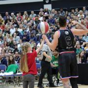 Player Mighty shows one of the audience some ball skills. Picture: Ollie Barnes