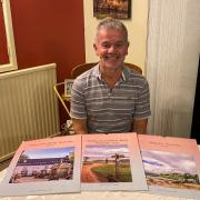 South Wales Argus Camera Club member Larry Wilkie and his charity calendars