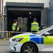 Police in Corn Street, Newport, where a woman was found dead.