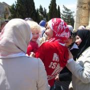 SYRIAN SNAP-HAPPY: My daughter Carys surrounded by Syrian schoolgirls