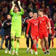 JOY: Wales goalkeeper Danny Ward (left) applauds the fans as Connor Roberts and David Brooks (right) celebrate after the win against Croatia
