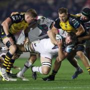 BACK: Dragons lock Ben Carter, right, makes a tackle against the Ospreys in November
