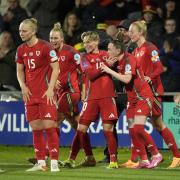 DELIGHT: Wales' Rachel Rowe (centre) celebrates with team mates after scoring the third goal