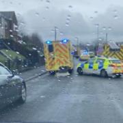 Emergency services at crash scene as road closed