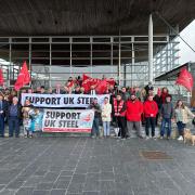 Unite members demonstrating outside The Senedd to hand in their petition.