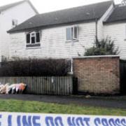 MURDER SCENE: Flowers were left outside the flat in Broadmead Park, Newport where the body of Nikitta Grender was found