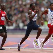 EASING THROUGH: Newport’s Christian Malcolm, centre, qualifying for the 200m semi-final