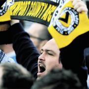 SUPPORT: A Newport County fan salutes the team after they defeat Grimsby Town