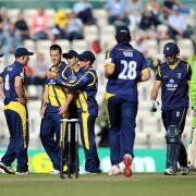 Glamorgan's Jim Allenby (third left) is congratulated by his team mates after taking the wicket of Hampshire's James Vince (second right) during the Clydesdale Bank Pro40 Semi Final match at the Ageas Bowl, Southampton. PRESS ASSOCIATION Photo.