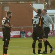 BEARD LUCK: Robbie Willmott is shown the red card by referee Andy Haines at Fleetwood last Saturday.  Picture: ROB LOCK
