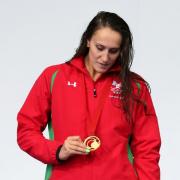 IT'S REAL: Wales' latest golden girl Georgia Davies checks out her medal on the podium
