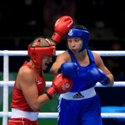 MEDAL: Bargoed boxer Lauren Price, right, in dominant action against Australia's Kaye Scott