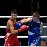 DEFEAT: St Joseph's boxer Joe Cordina, left, gets caught by Scotland's Charlie Flynn