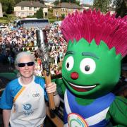 THE PARTY'S OVER: Glasgow 2014 mascot Clyde, right