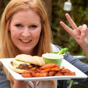 Argus reporter Fran Gillett with the 'peace burger'