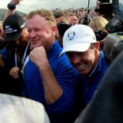 SPECIAL MOMENT: Welshman Jamie Donaldson after hitting the winning shot in the 2014 Ryder Cup.  To the right is Rory McIlroy who had earlier thrashed Rickie Fowler to set Europe on course for victory