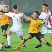 CUP BATTLE: County's Corey Shephard, left, and Tom Owen-Evans in action against MK Dons in the FA Youth Cup