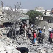 This citizen journalism image provided by Edlib News Network, ENN, which has been authenticated based on its contents and other AP reporting, Syrians search under rubble to rescue people from houses that were destroyed by a Syrian government warplane, in