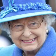 Queen Elizabeth II smiles as she arrives at Tweedbank, on the day she becomes Britain's longest reigning monarch, as she and her husband, the Duke of Edinburgh, travel by steam train to inaugurate the new  294 million Scottish Borders Railway. PRESS