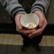 A ban on beggars near city centre cash machines is being considered