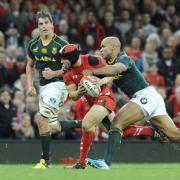 RETURN: Wing JP Pietersen, pictured tackling Leigh Halfpenny two years ago, is on the Boks' right wing