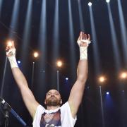 Britain's Tyson Fury celebrates after winning in a world heavyweight title fight for Ukraine's Wladimir Klitschko's WBA, IBF, WBO and  IBO belts in the Esprit Arena in Duesseldorf, western Germany, Sunday, Nov. 29, 2015. (AP Photo/Martin Meissner).