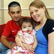 INSPIRATION: Myleisha Hussein who is suffering from leukaemia after contracting meningitis pictured with her parents Kamal and Layla