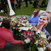 TRIBUTES: Flowers laid in Parliament Square following the killing of MP Jo Cox