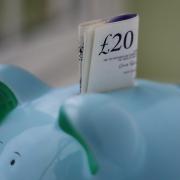 File photo dated 06/01/15 of money in a piggy bank, as Prime Minister David Cameron announced that low-paid workers who put money away in a new savings scheme will be rewarded with a bonus of up to Â£1,200. PRESS ASSOCIATION Photo. Issue date: Monday