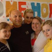 RETURN: Richard Jenkins is welcomed home after he helped rescue three people from a helicopter crash in the Himalayas. Pictured with his daughters, from left; Abbie, Sam, wife Nadine and Tamazin. Picture from 2008.