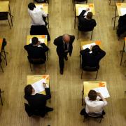File photo dated 07/03/12 of pupils sitting an exam, as head teachers warned that grammar schools are considering asking parents for cash to make up budget shortfalls set to be caused by changes in funding..