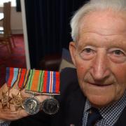 HONOURS: Bob Curzon with his medals earned during the Second World War