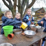 Usk Church in Wales Primary School of the week. Reception in the mud kitchen.  www.christinsleyphotography.co.uk