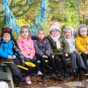 Nursery school pupils enjoy the school garden