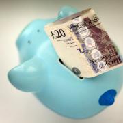 File photo dated 06/01/15 of money in a piggy bank. Pension savers' money will have stronger protections as a new law to drive up standards in schemes used by millions of people to save for retirement has come into force. PRESS ASSOCIATION Photo. Issu
