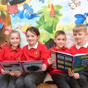 Year 4 reading L-R Ffion Rolph, Alicia Manley, Jake Bennett and George Tavener at Coed Eva Primary who are school of the week . www.christinsleyphotography.co.uk