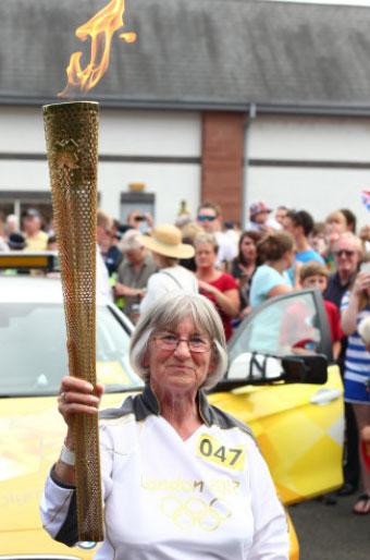 Dorothy Turner of Caldicot carrying the torch in Abergavenny