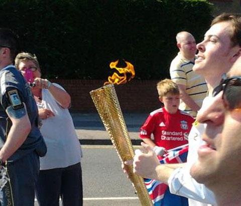 Olympic Torch in Maesglas on Cardiff Road. Taken by Tony Plackett.