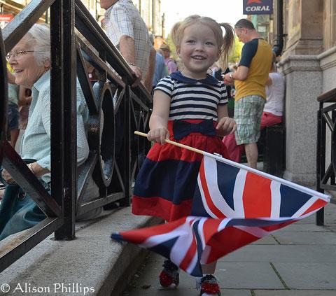 Joavie Pitman waiting for the torch bearer to arrive at Stow Hill, Newport - My Grandaughter. From Alison Phillips, Cwmbran.