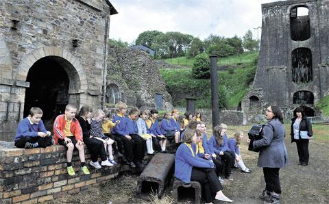 OUR HERITAGE: Children from Blaenavon Heritage School practise their singing at the Iron Works,
in preparation for their part in Cauldrons and Furnaces at the World Heritage Site between June 29
and July 1 Picture: BECKY MATTHEWS BM_150