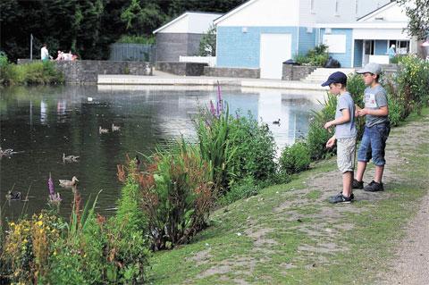 SUMMERTIME: Sam and Tom Berry feed the ducks at Cwmbran Boating Lake MM_8391