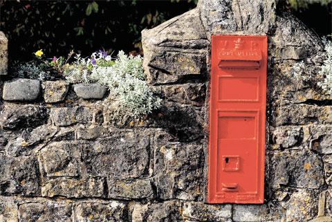 SIMPLY RED: It’s hard to miss this postbox set into a wall at Redwick ML_13309 Picture: MIKE LEWIS