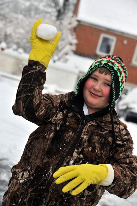 Harry Edwards, 11,  throws a snowball.
