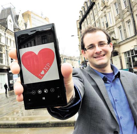 CAMPAIGN: Paul Halliday proudly displays the I love Newport logo on his phone