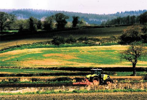 BUSY: A tractor ploughs the countryside as viewed from Bishton Road ML-13763